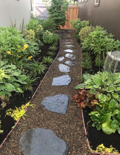 Gravel walkway with plantings