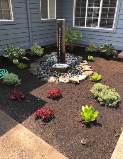 Waterfall with gravel and plantings